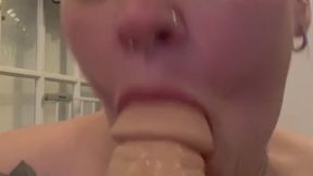 Cute BBW sucking on fat white dildo