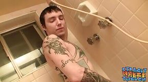 Thug with tattoos stroking his big dick in bathroom