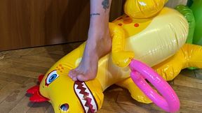 Nastya, barefoot and wearing beautiful black panties, sits on inflatable dinosaurs, sits on their faces, steps on them, tramples them, and walks on them. foot fetish, trampling, and barefoot