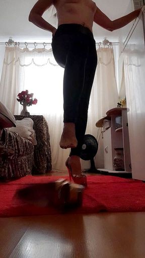 Stefany Karoliny, wearing bright shiny leg pants so you can slip between them and wearing her beautiful high heel shoes