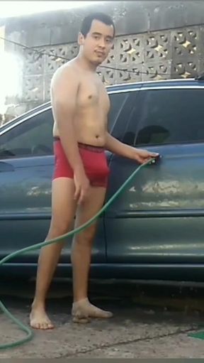 Jesus in red boxer washing his jaguar car