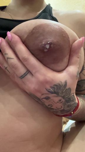 Lactating MILF shows off big tits and feeds baby