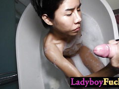 Watch this small Asian tranny Kwan give a perfect handjob to a big hard cock