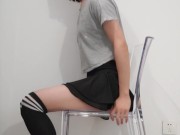 Crossdresser in skirt seems left a thing on the chair...