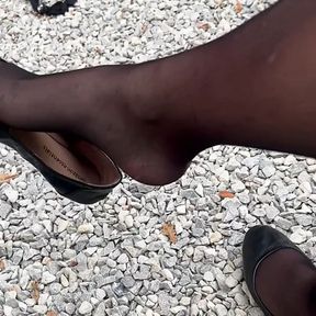 Shoe dangling outdoors in stockings