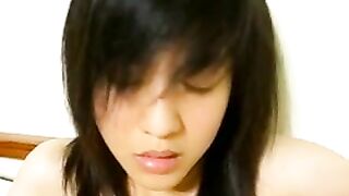 Chinese cutie strips and masturbates