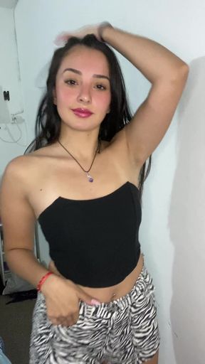 Woman in black tank top and zebra shorts