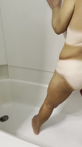 Undressing and peeing in the tub