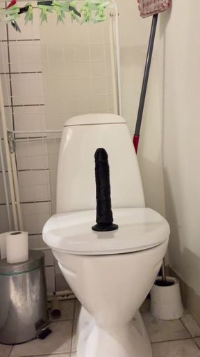 Sit on black dildo