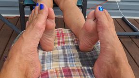 Playing footsie in the hot sun with our bare feet