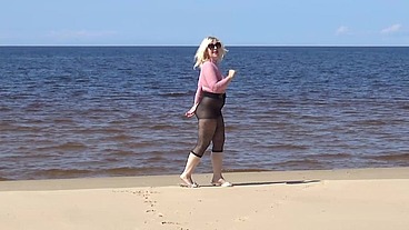 Funny milf with nylon ass and tits on beach