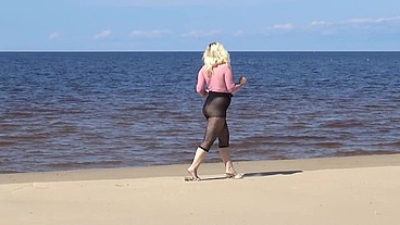 Funny milf with nylon ass and tits on beach