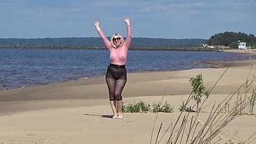 Funny milf with nylon ass and tits on beach