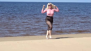 Funny milf with nylon ass and tits on beach