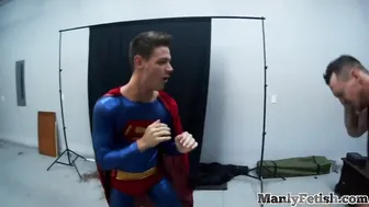 Submissive costumed bottom gets stroked while sucking a dildo