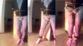 pee desperation: tied up by his flatmate, this guy tries to resist while his cock and balls are played with. he gets a boner and finally wets himself