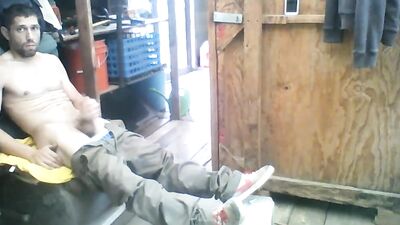 Jay D is stroking his hard pecker inside the warehouse