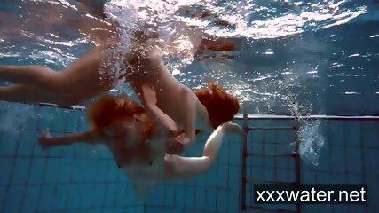 Milana and Katrin strip eachother underwater