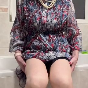 In a blue dress masturbated with the vibrator