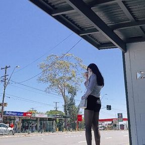 asian crossdresser wearing stockings at bus stop