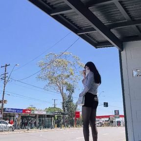 asian crossdresser wearing stockings at bus stop