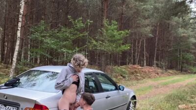 Young man sucks his step-friends giant dick in the open air, while sitting on a car