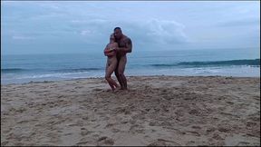 romantic dancing of a naked couple on a public beach