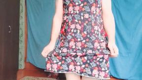 Playful trans girl showing thigh tattoo in short skirt