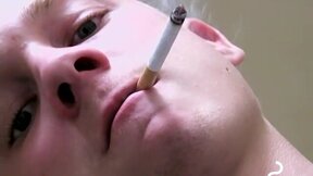 Twink savors the pleasure of smoking and stroking cock