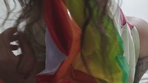 Sexy girl playing with colorful balls in bed