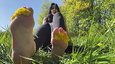 Footfetish in the park on the grass