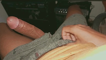 Horny guy in shorts jerking off his big cock dripping with pre cum