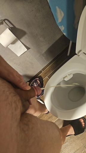 Taking a piss.