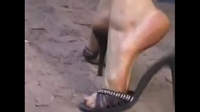 Lana walking in high heel sandals