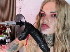 Tattooed Blonde Sucks Massive Dildo