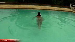 Tatooed ebony tgirl plays with good sized shemeat by pool