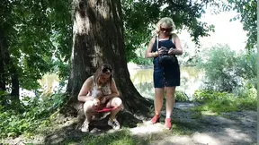 Two girls stopped on the side of the road to pee &mdash;  attracting the attention of passing cars &mdash;  golden shower in a public place