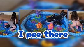 Mistress Mersiiik stomps on inflatable fish and a black orca in the pool, stepping on them with her bare feet and crushing them with her full weight; finally, she pees on the orca and the fish. inflatable bare feet golden shower peed pissed on