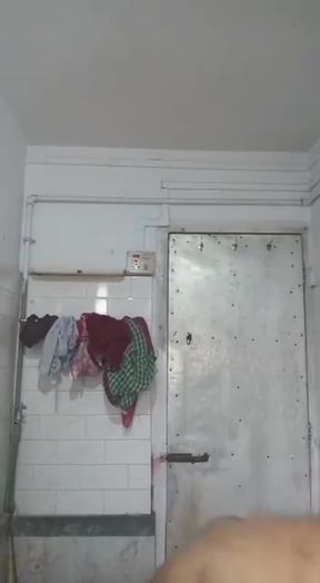 Indian teen shows off her naked boobs in a shower close-up