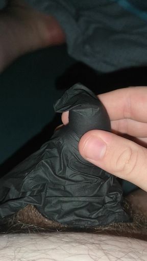 Cumming into a latex glove