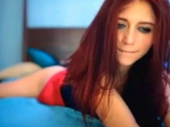 Redhead beauty reaches orgasm on webcam alone.