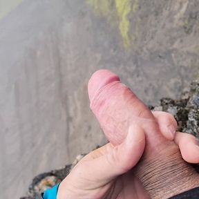 Cliffwanker - Felixproducer wanks on a rock and shoots his sticky load of sperm down that cliff