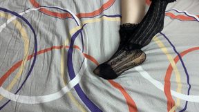Caressing Long Legs of Girl in Black Lace Socks