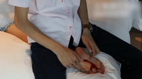 GG33 - Bare feet bound by red ropes are played with