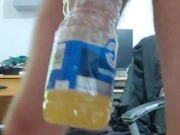 Pissing in the empty bottle like a champ