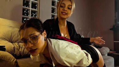 The strict teacher punishes her student by spanking her