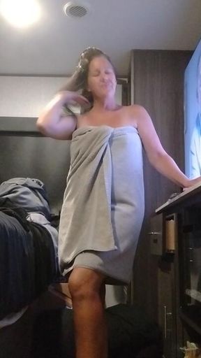 Gigi rubs oil all  over her naked body fresh out of the shower