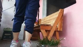 Woman smelling her socks and feet after arriving from training (7)
