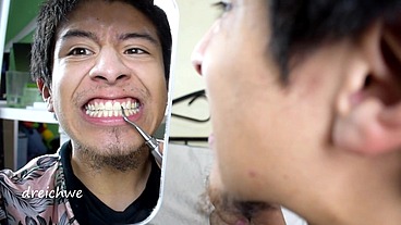 Checking my teeth in the mirror