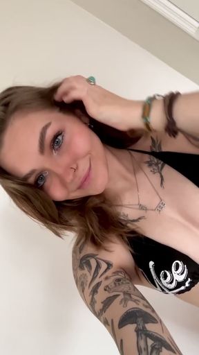Tattooed beauty in bikini